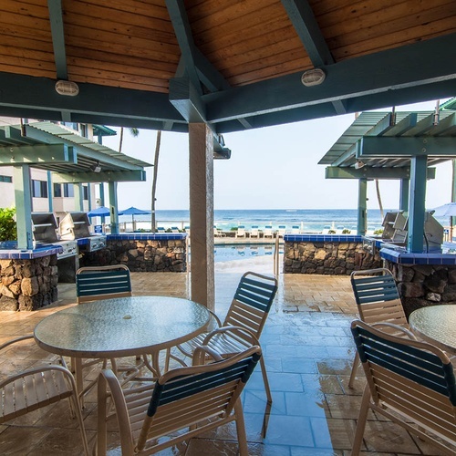 Outdoor grills at Travel Raintree Corpo with ocean and pool views.