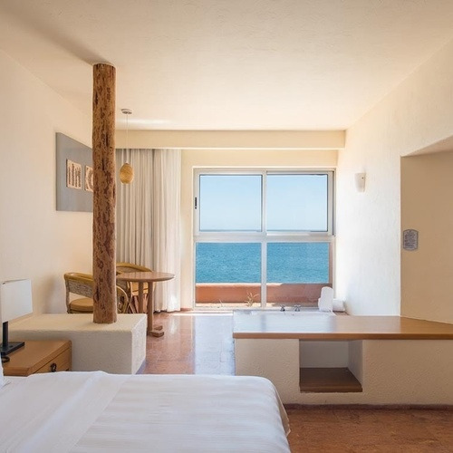Ocean view hotel room with a soaking tub, perfect for Travel Raintree Corpo stays.