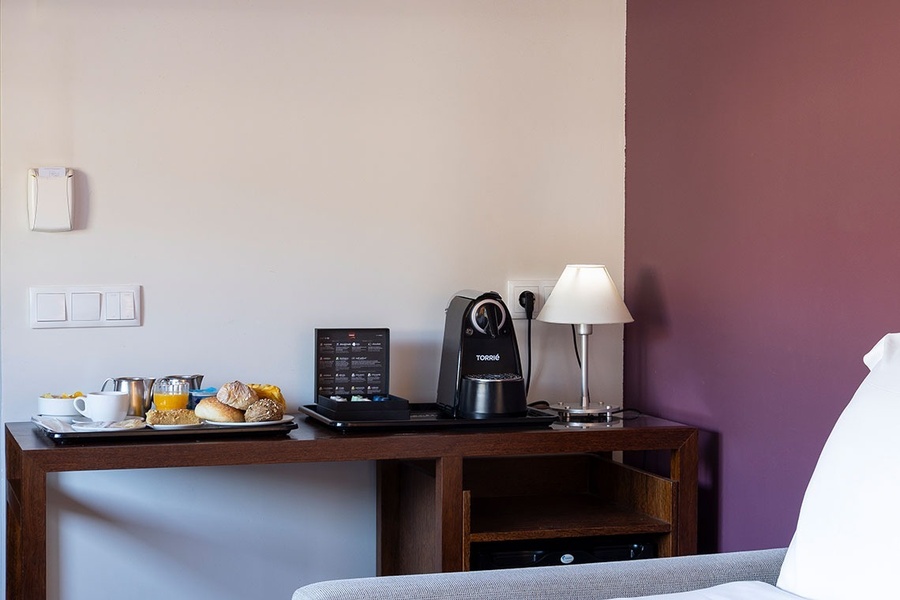 a room with a coffee maker that says ' nespresso ' on it