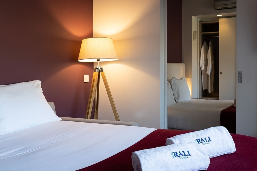 a bed with two towels that say ' bali ' on them