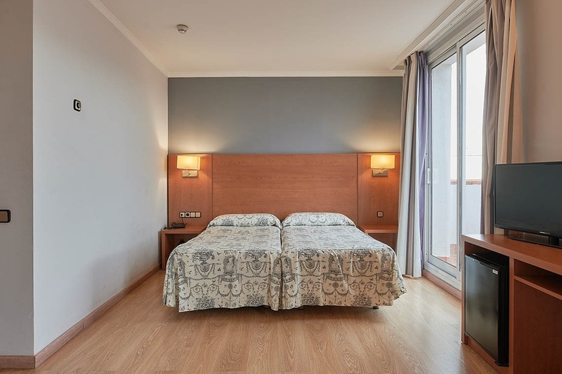 Habitación clásica, confort y funcionalidad