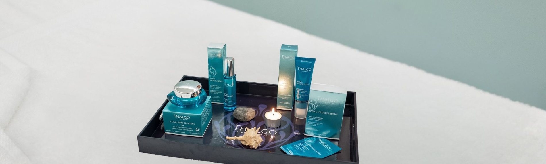 two massage tables in a room with a towel warmer