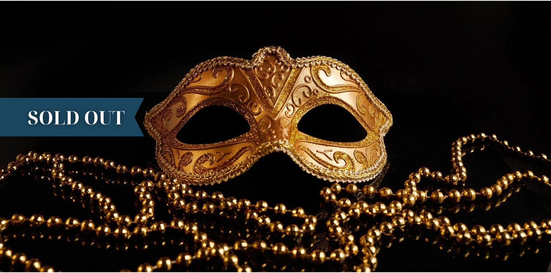 a gold mask is surrounded by gold beads and a sold out banner