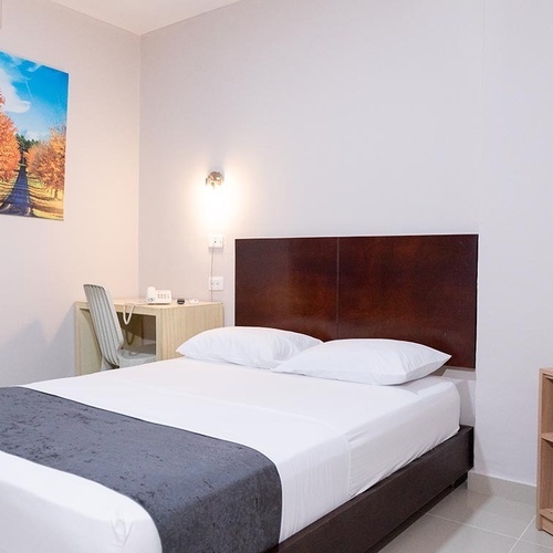 Habitación limpia y cómoda en Hotel Ribai Corporativa.