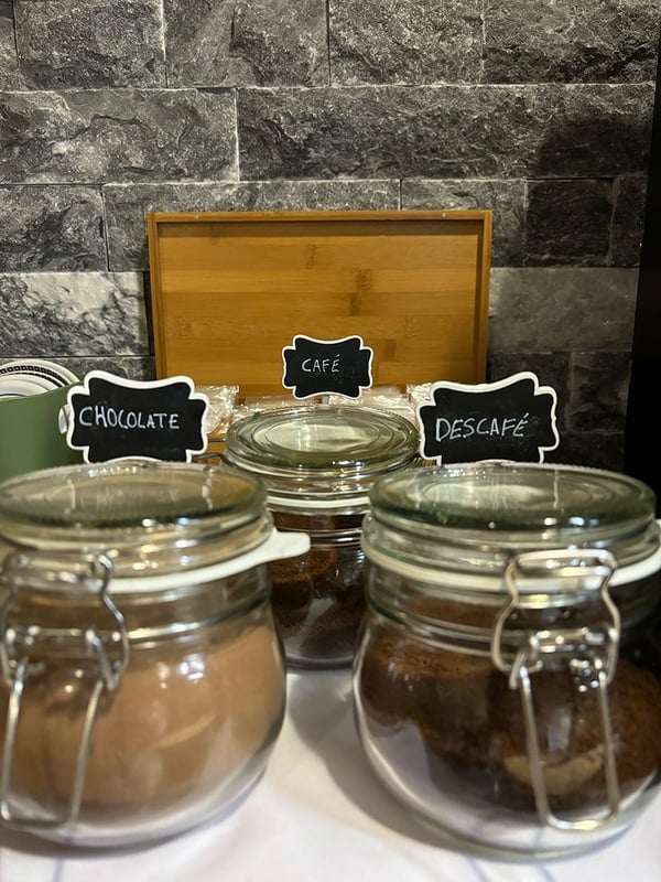 a jar of chocolate next to a jar of descafe