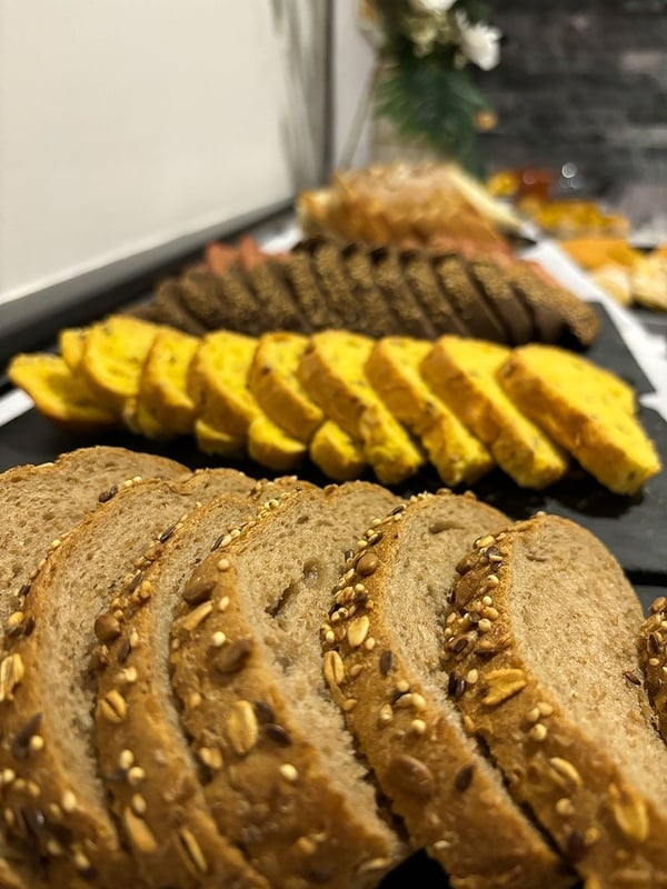 slices of bread with sesame seeds on them on a table