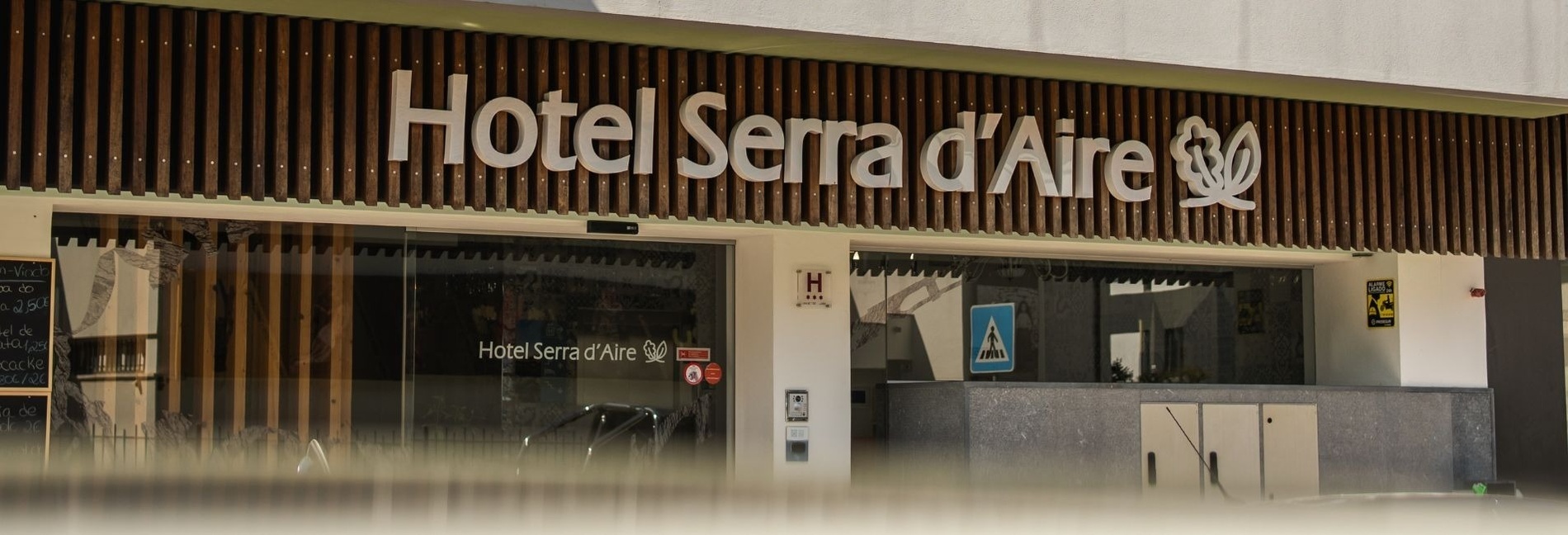 hotel serra d' aire has a sliding glass door