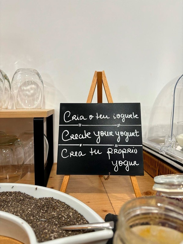 a sign on an easel that says create your yogurt