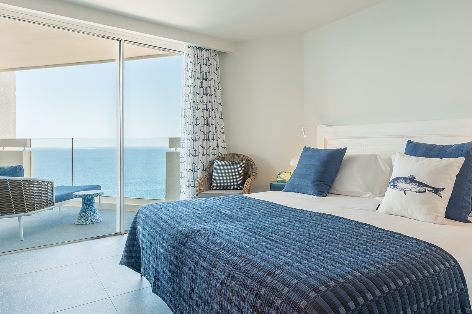 Satocan: The Salmar hotel room with sea view, balcony, and nautical decor.