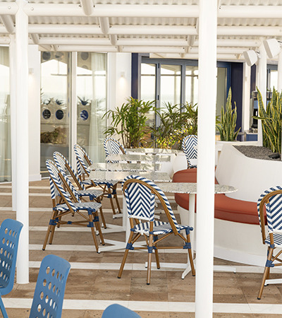 Satocan: The Salmar - Elegant lobby with checkered floors, plush seating, and ocean views.