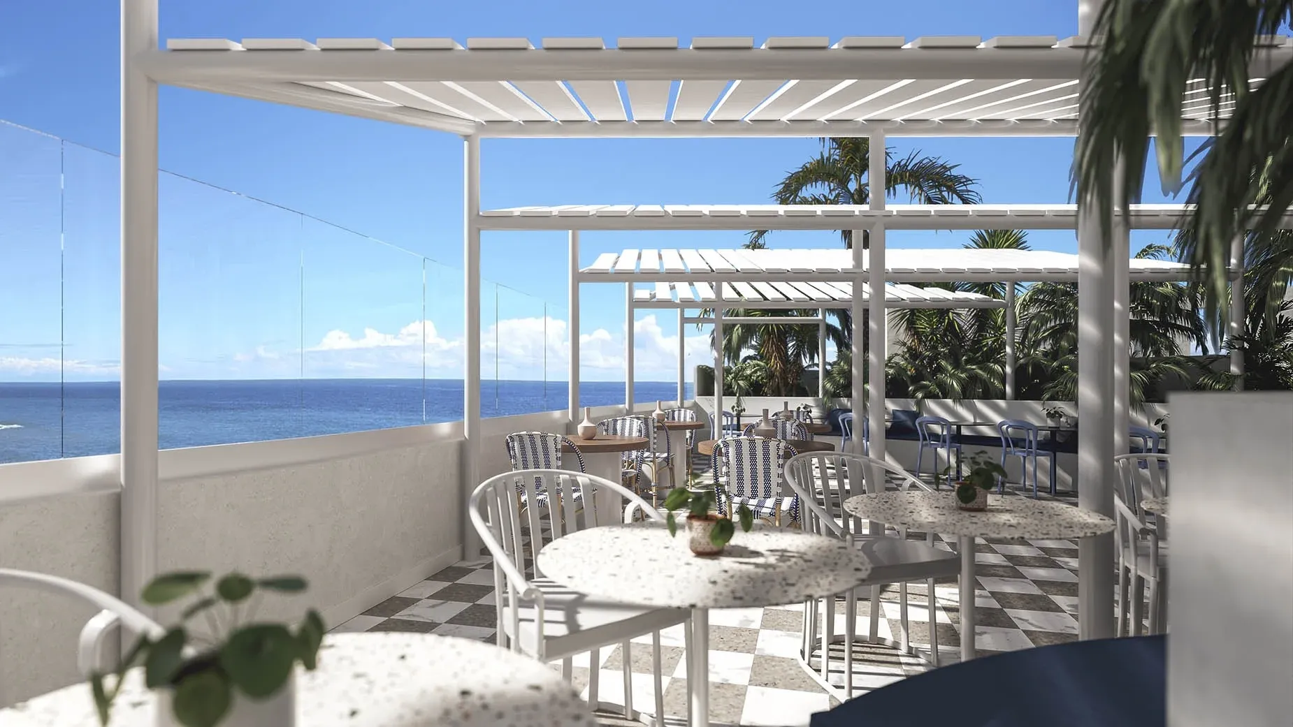 Terraza de hotel con vista al mar, mesas y sillas al aire libre, perfecto para Satocan: The Salmar.