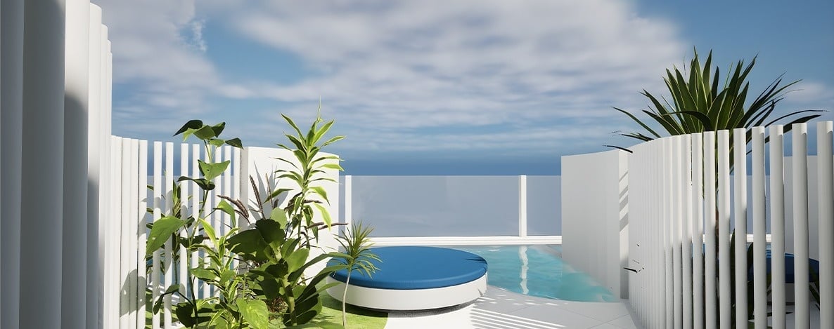 A minimalist outdoor space features white slatted walls, various green plants, a blue circular lounge, and a tranquil pool under a bright, cloudy sky.