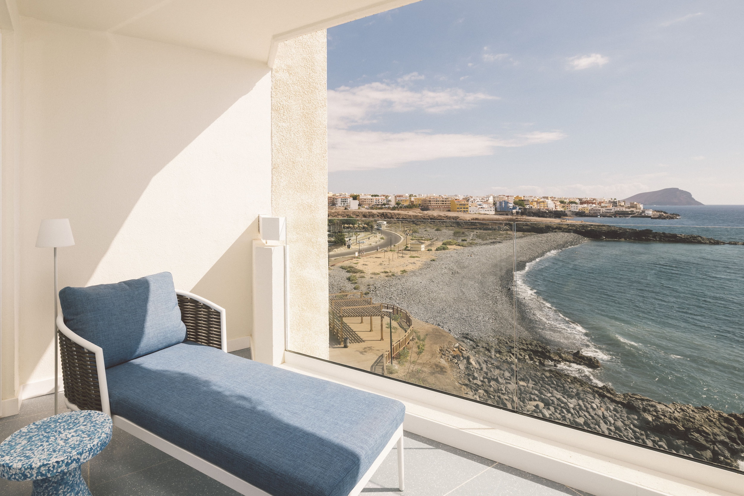 a hotel room with two beds and a painting on the wall