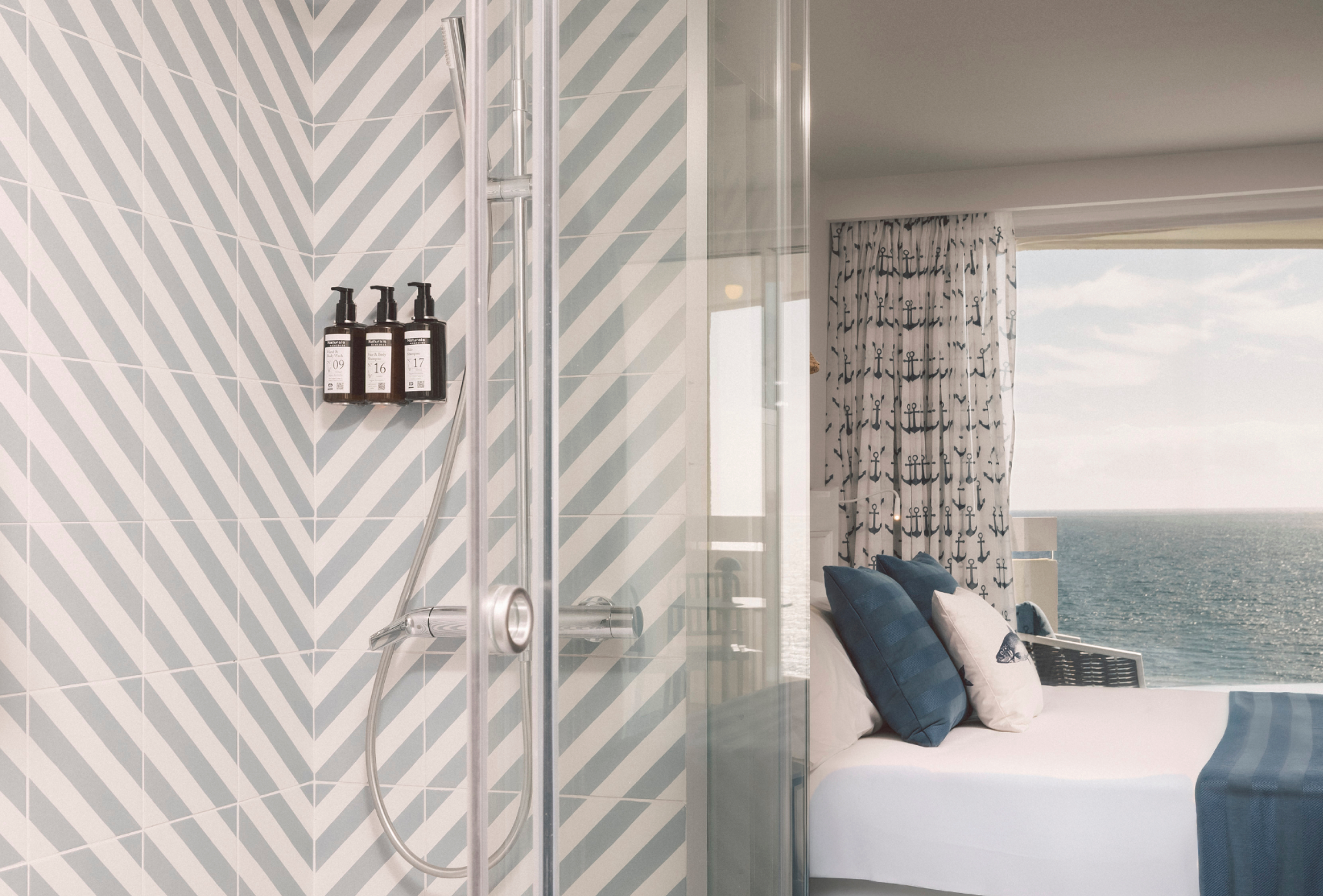 a large swimming pool surrounded by tables and umbrellas