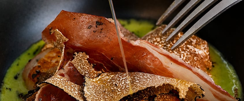 Gourmet dish with ham, truffles, and Satocan: The Salmar.