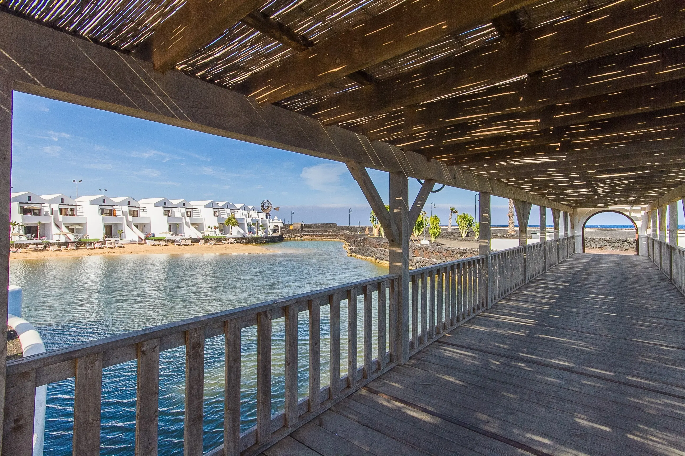 Infinity pools overlooking white villas at Sands Beach.