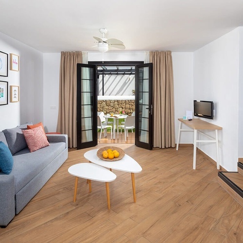 a living room with a couch and two coffee tables