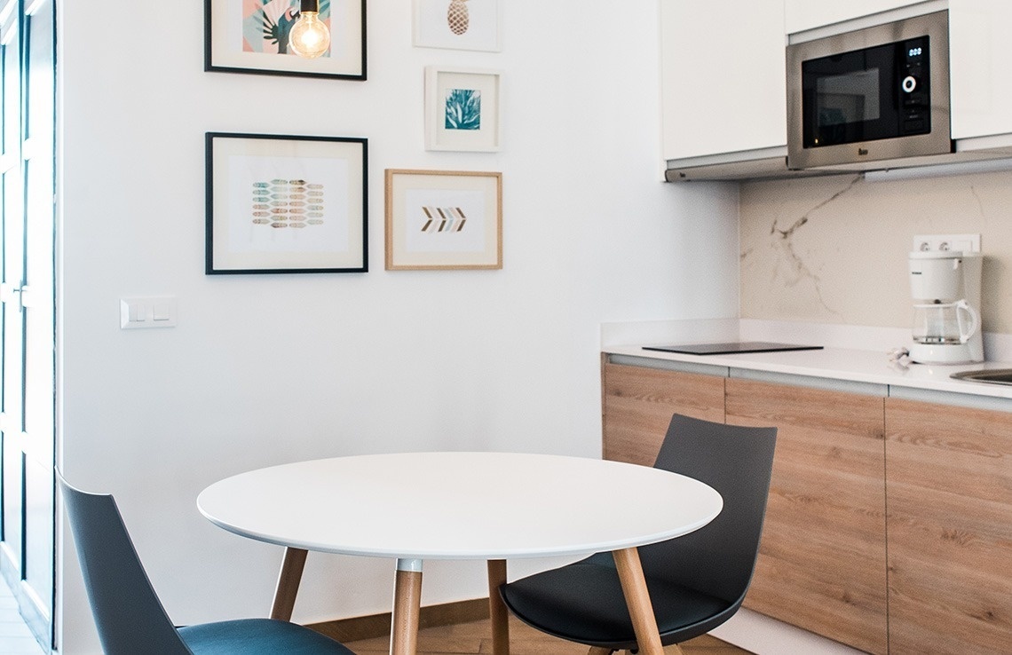 a kitchen with a microwave and a coffee maker
