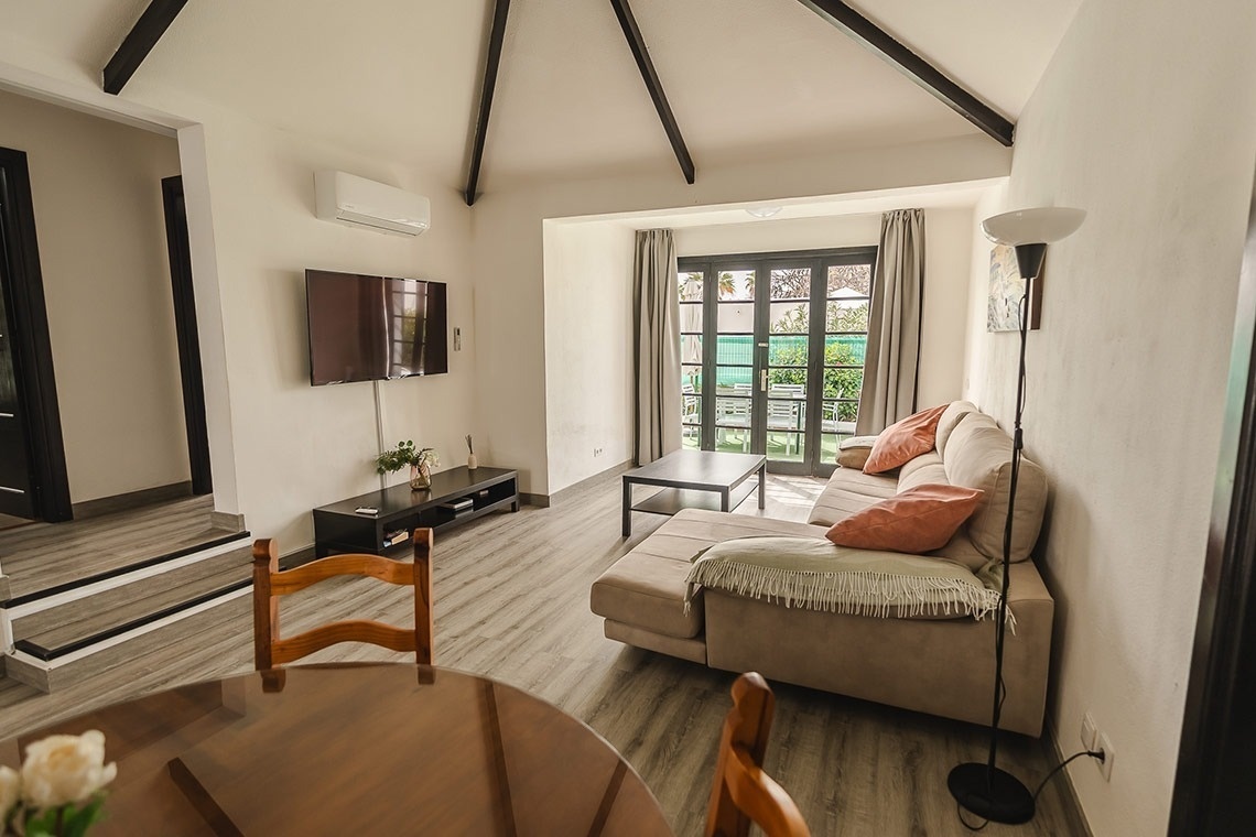 a living room with a couch and a flat screen tv