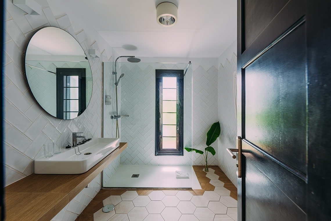 a bathroom with hexagonal tiles and a sink