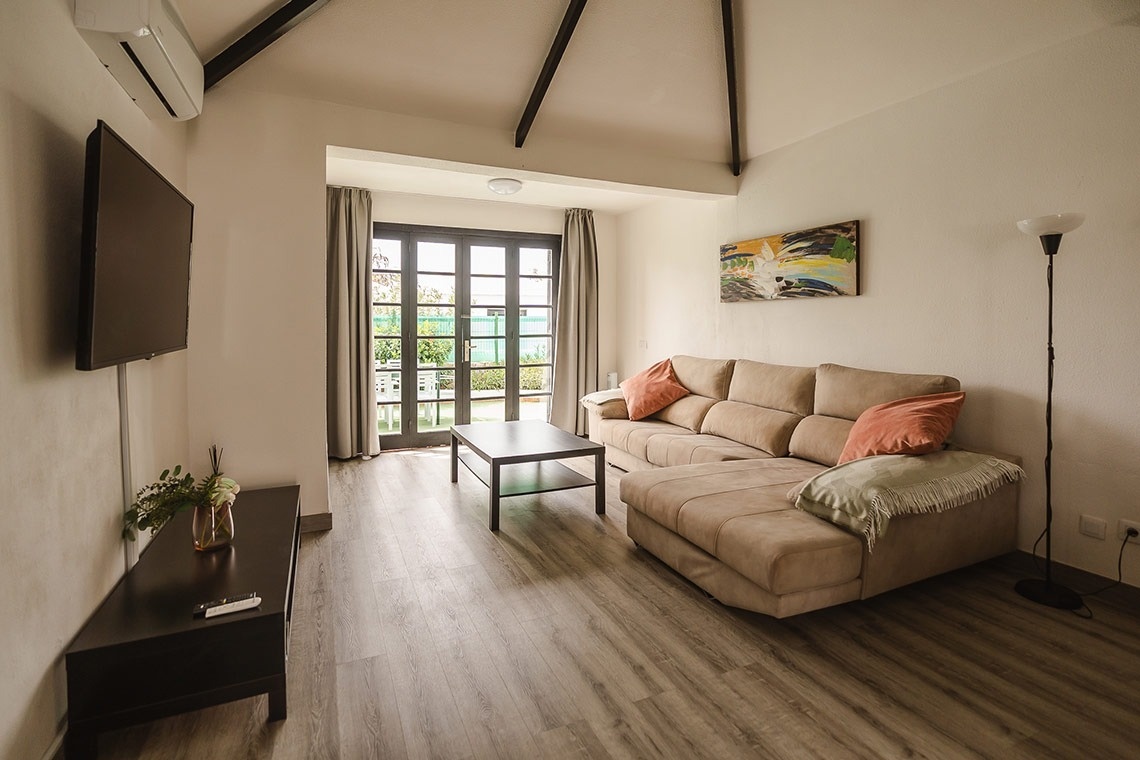 a living room with a couch and a flat screen tv