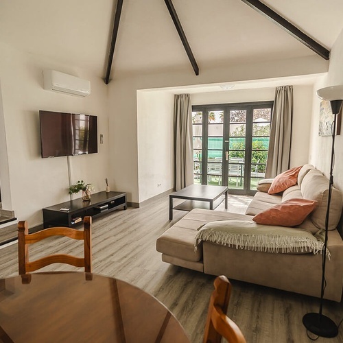 a living room with a couch and a flat screen tv