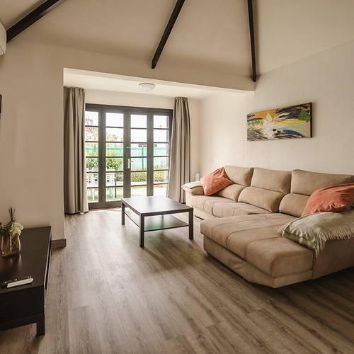 a living room with a couch and a flat screen tv