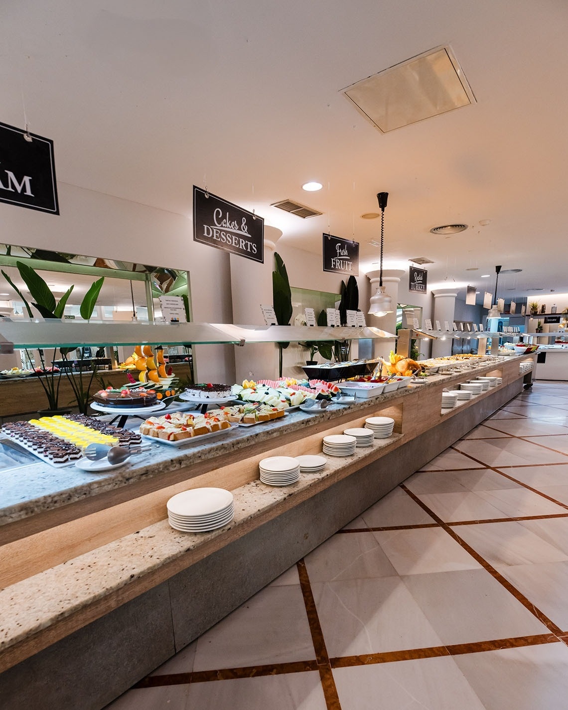 a buffet with a sign that says cake & desserts