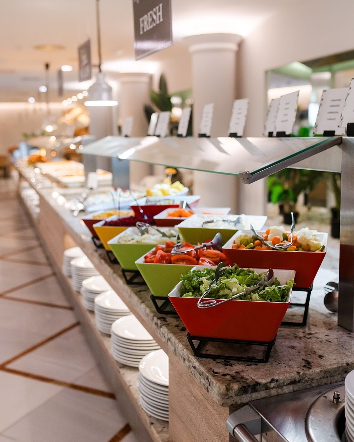 a buffet with a sign that says fresh on it