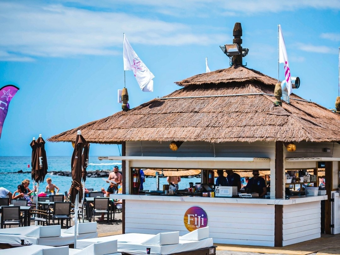 a thatched hut with the word fiji on it