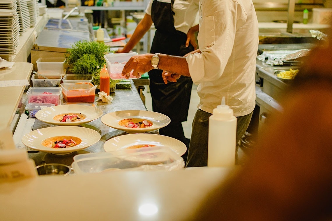 a chef is preparing a meal in a kitchen