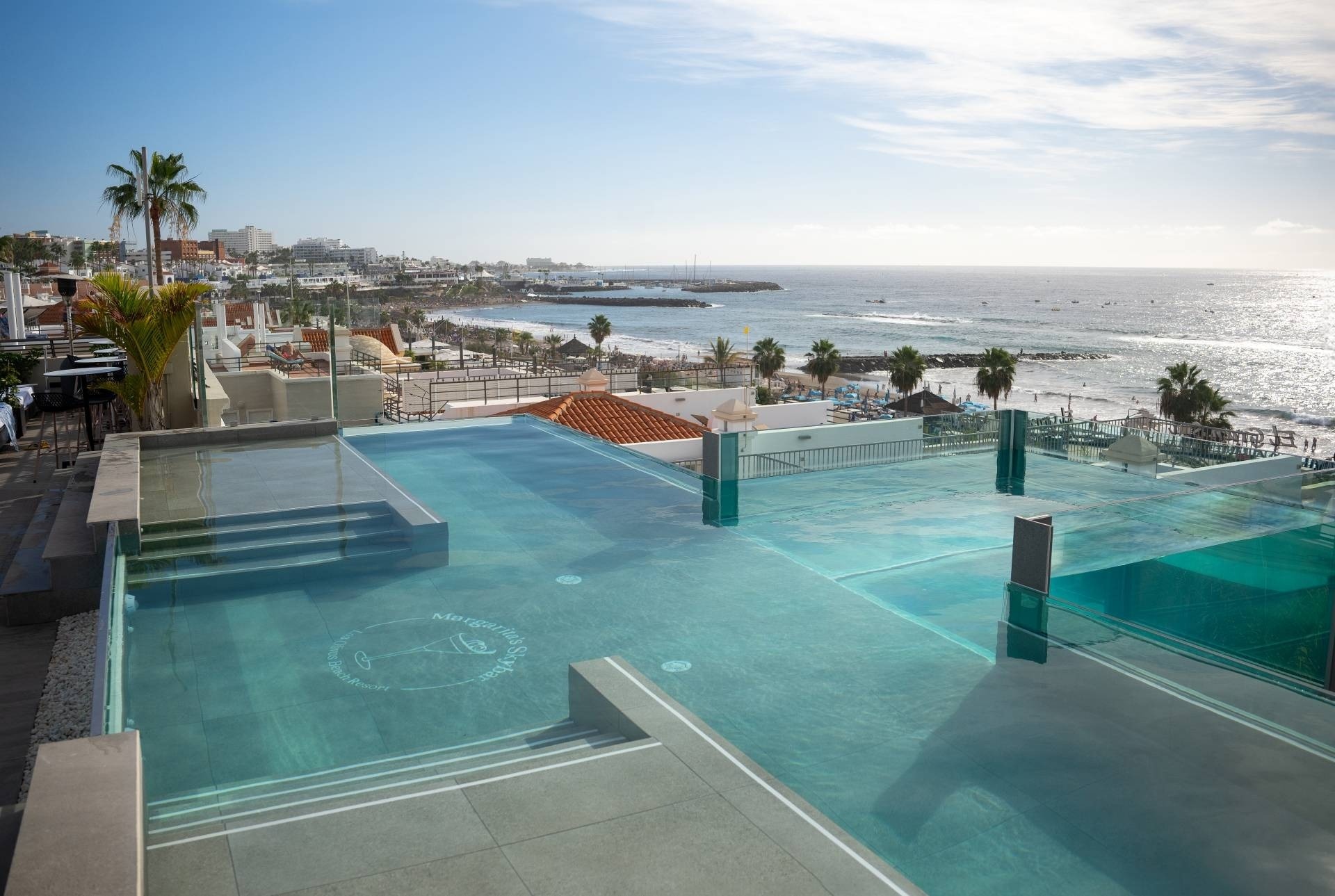 a large swimming pool with the word infinity on it