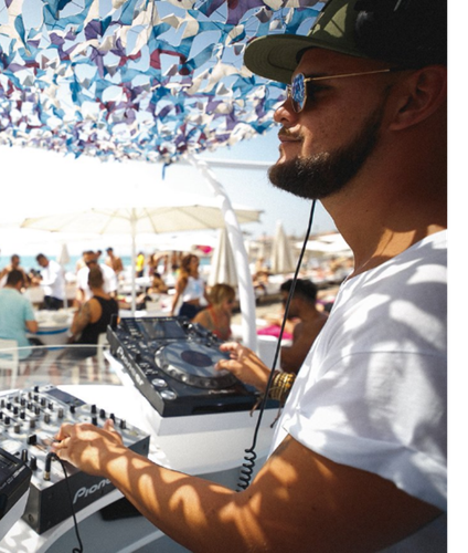 a waiter is serving a woman at a table with a sign that says al