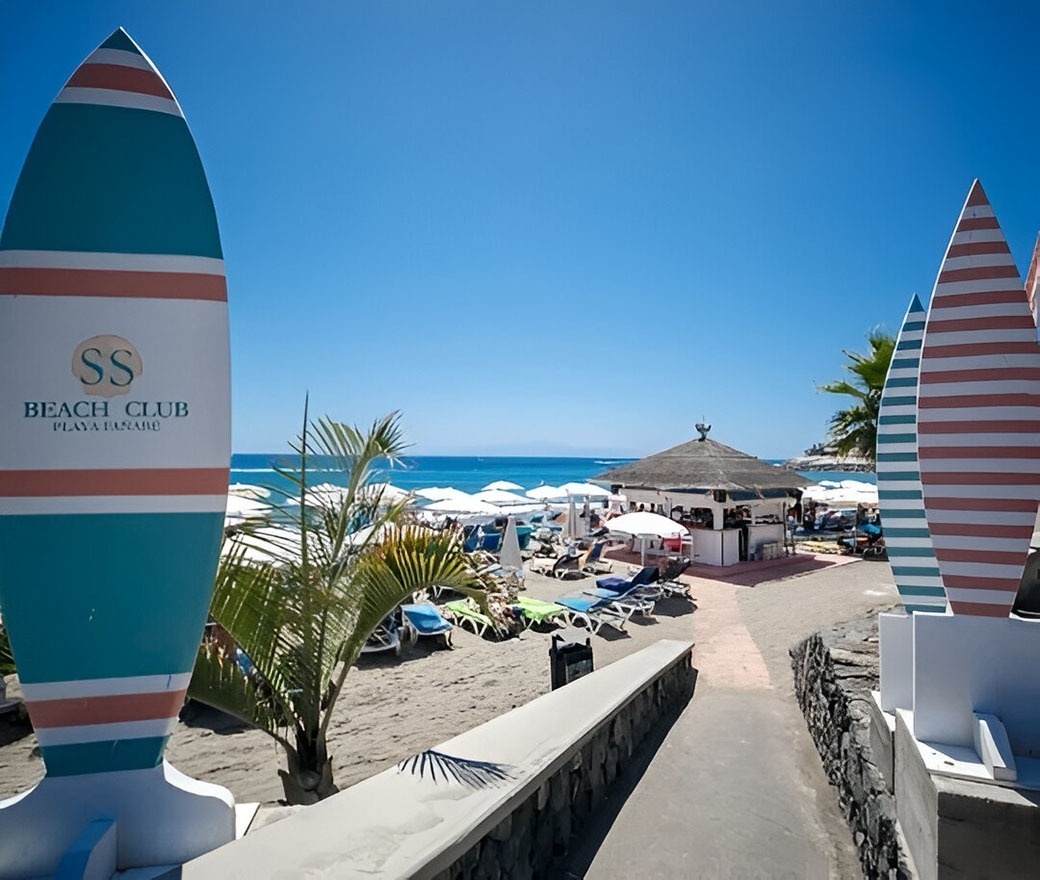 a surfboard with the word beach club on it