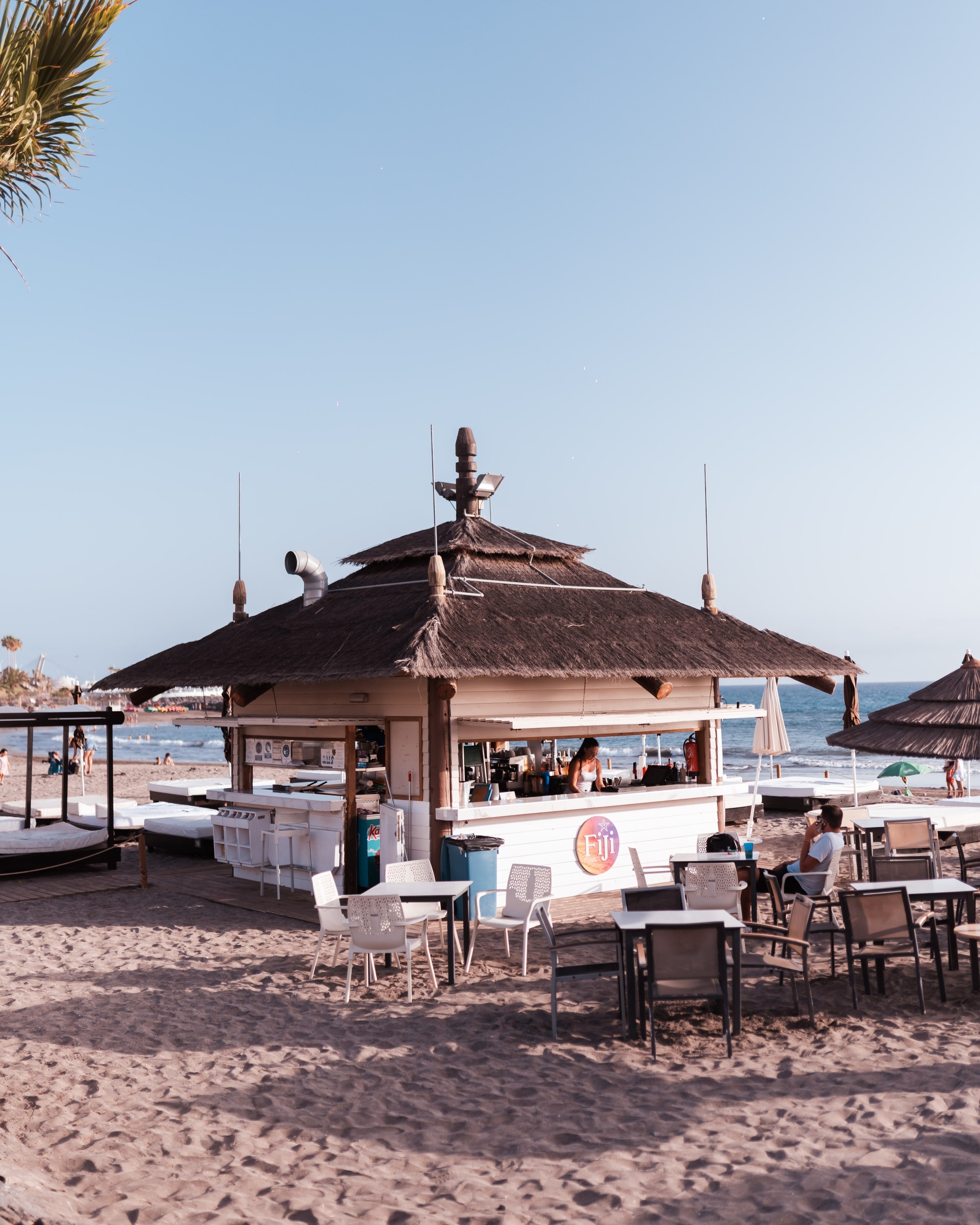a beach bar with a sign that says ' ecj ' on it