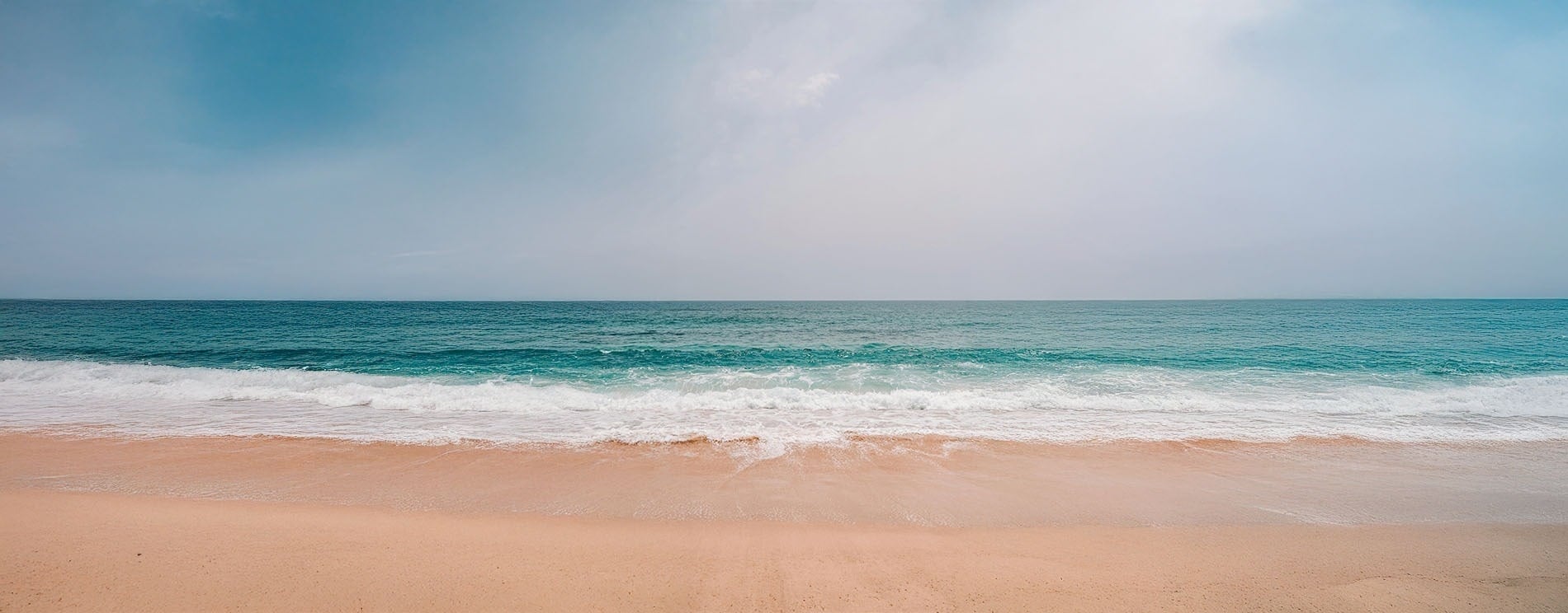tables and chairs with umbrellas in front of a pool