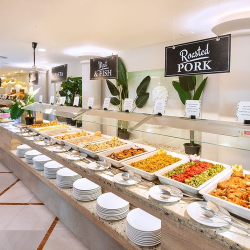 a buffet with a sign that says roasted pork