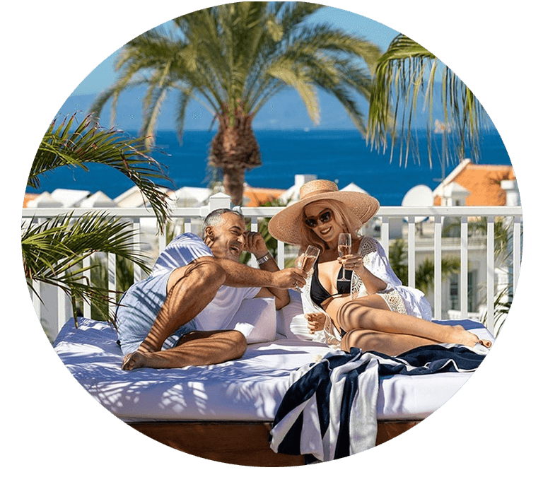 a green heart shaped leaf on a sandy beach