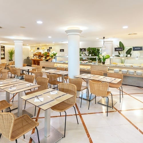 a restaurant with tables and chairs and a sign that says pasta