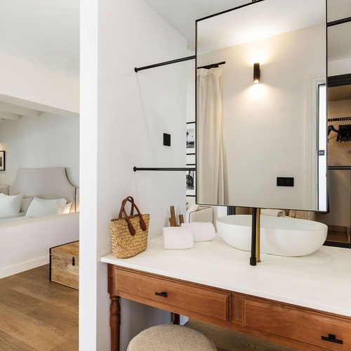 a bathroom with a sink and a mirror that says ' lotion ' on it