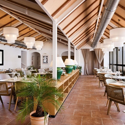 a dining room with lots of tables and chairs