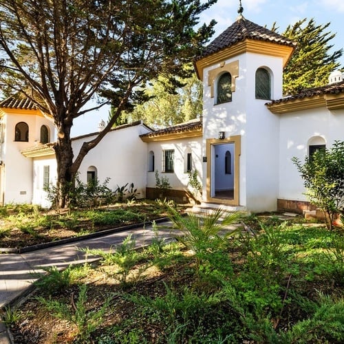 a white building with a tower on top of it
