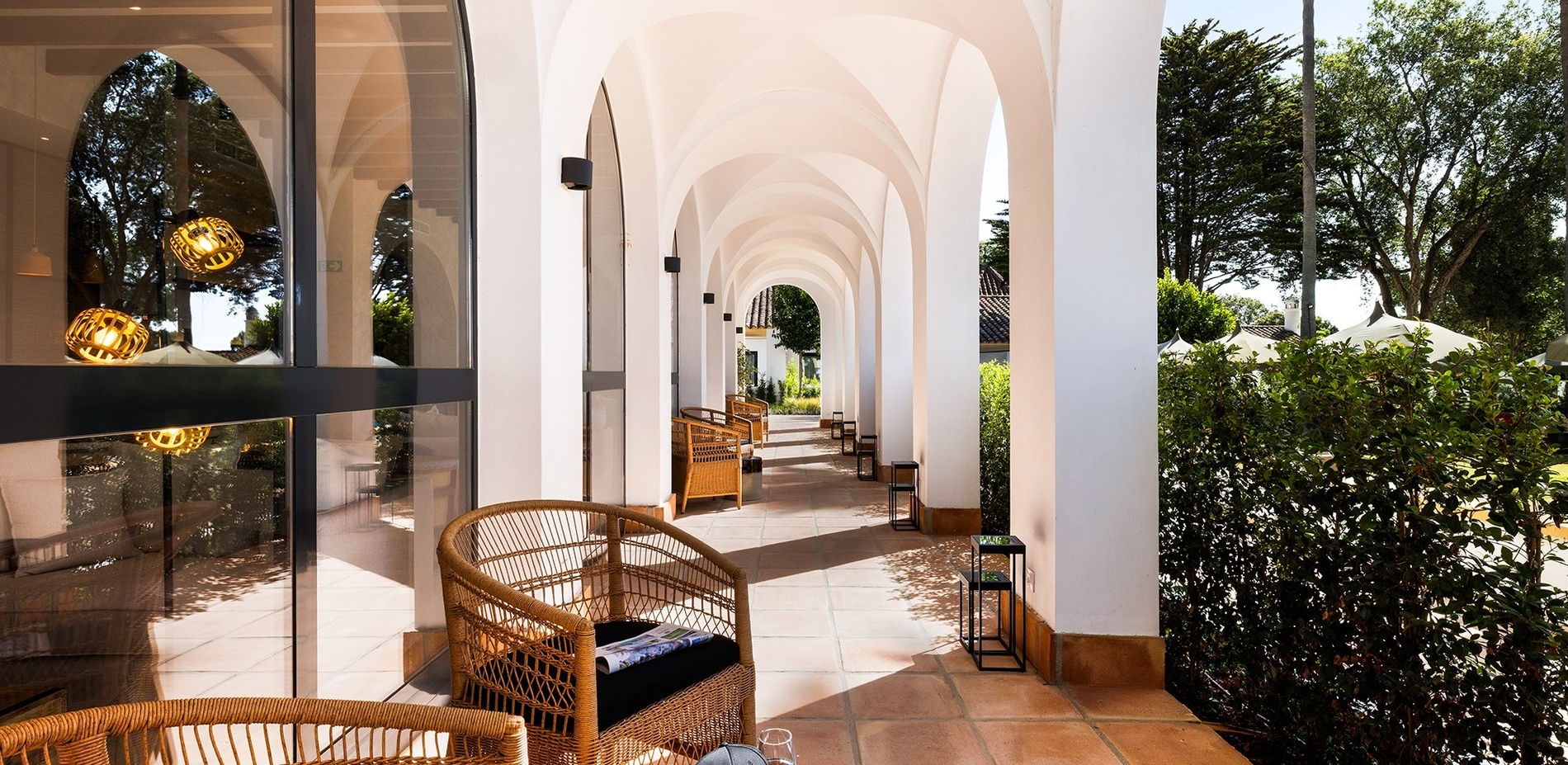 an artist 's impression of a hallway with arched windows