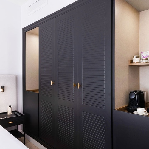 a bottle of gin sits on a shelf next to a bottle of jack daniels