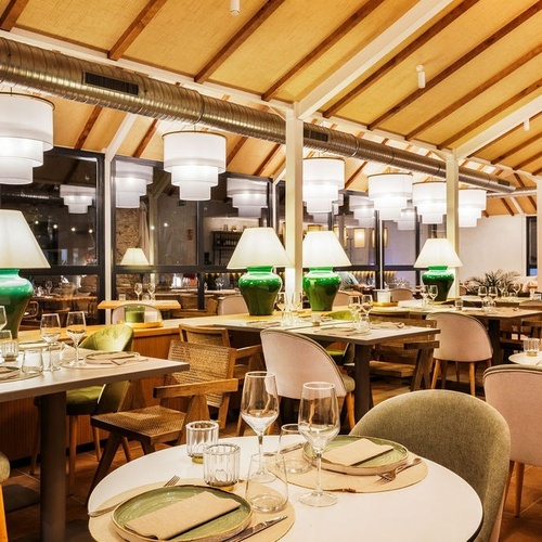 a restaurant with a lot of tables and chairs