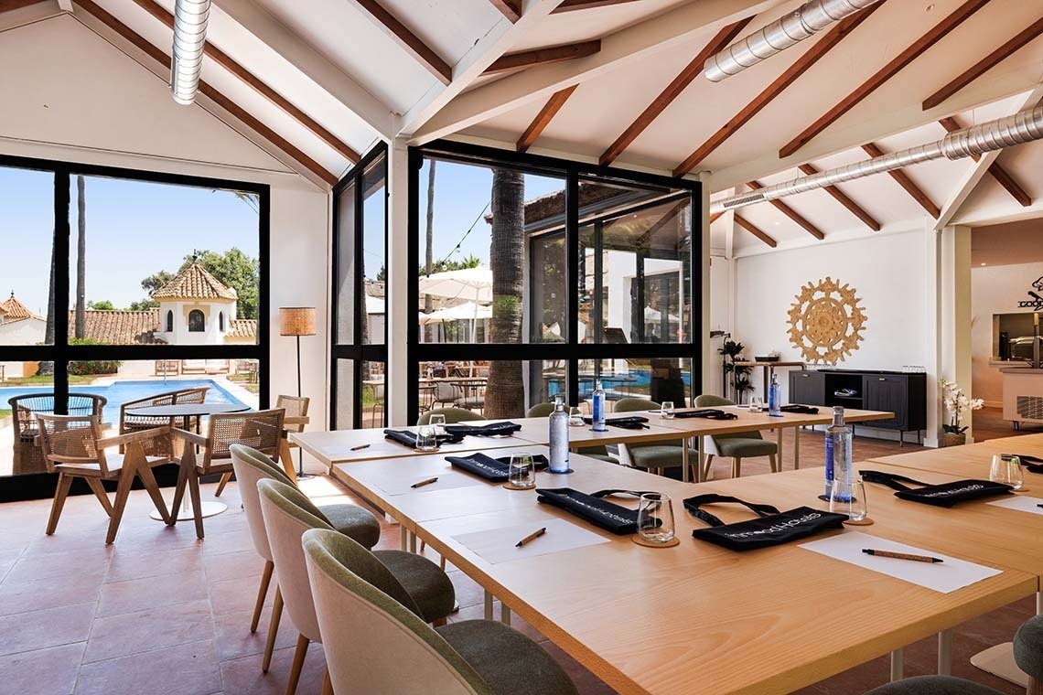 a conference room with a long table and chairs and a projector