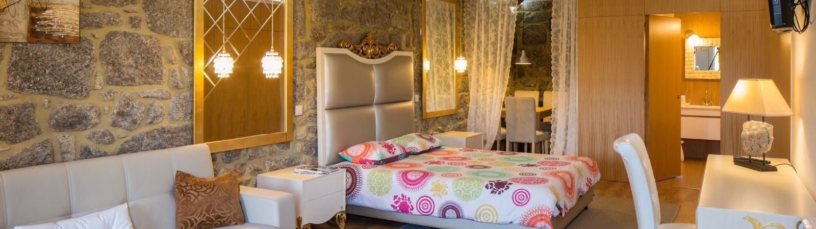 a bedroom with two beds and a mirror