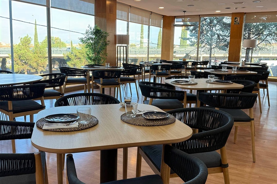 a restaurant with tables and chairs and a sign that says wifi