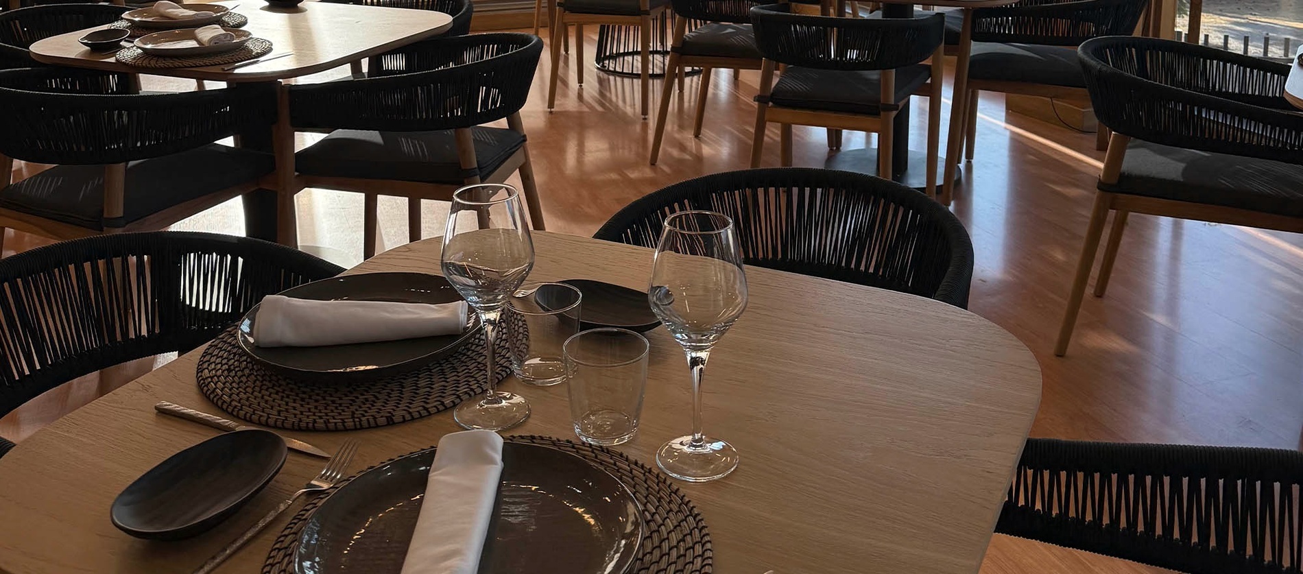 an aerial view of a city with white buildings and brown roofs