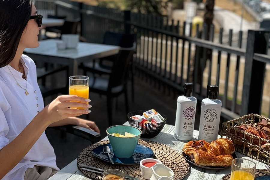 a man is giving a presentation in front of a projector screen
